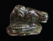 A ROMAN BRONZE HORSE HEAD APPLIQUE Circa 2nd-3rd century AD. The horse head, slightly turned to its proper right, is framed by two 'wings' and emerges...