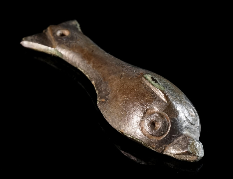 A ROMAN BRONZE APPLIQUE IN THE FORM OF A DOLPHIN Circa 2nd-3rd century AD. Worke...