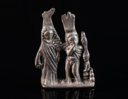 A ROMAN SILVER AMULET PENDANT OF ISIS AND HARPOCRATES The divine pair Isis and her son Harpocrates, or 'Horus the child', are facing the viewer. Both ...