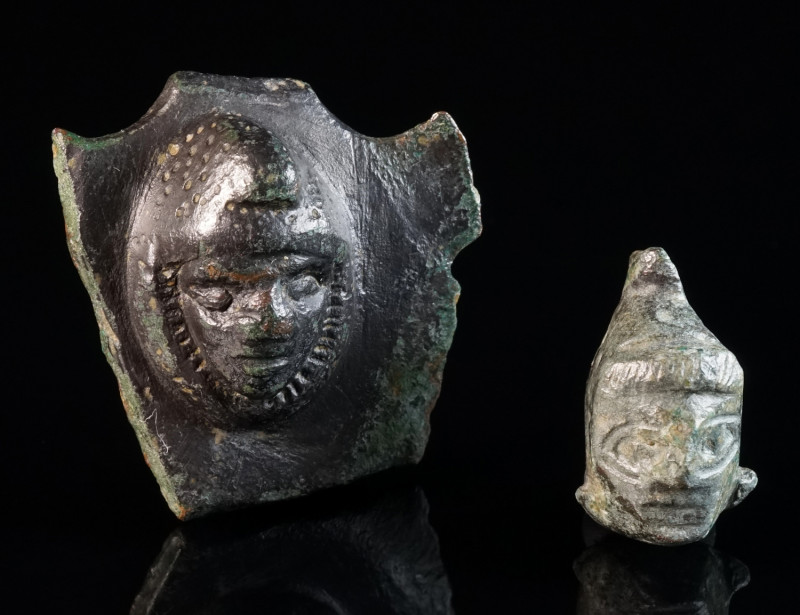 TWO ROMAN BRONZE APPLIQUES WITH A HEAD OF ATTIS Circa 2nd-3rd century AD. Both s...