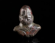 A ROMAN BRONZE APPLIQUE IN THE SHAPE OF A MALE BUST Circa 2nd-3rd century AD. Small bust of a bearded bold man with bare chest. Probably the depiction...