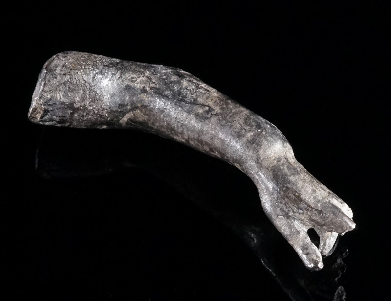 A ROMAN SILVER ARM OF A STATUETTE Circa 1st-3rd century AD. Left arm of a male s...