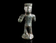 A SMALL ROMAN BRONZE STATUETTE OF MERCURY Circa 2nd-3rd century AD. A highly abstracted representation of probably Mercury on a round base; the god is...
