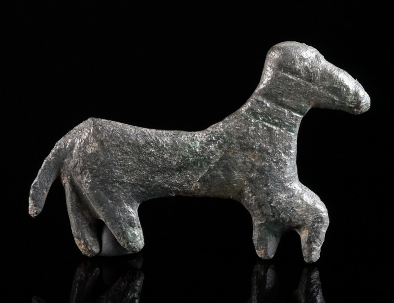 A ROMAN BRONZE FIGURE OF A HORSE Circa 2nd-3rd century AD. Figure of a striding ...