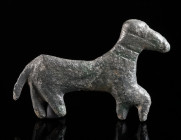A ROMAN BRONZE FIGURE OF A HORSE Circa 2nd-3rd century AD. Figure of a striding horse with the right foreleg raised; bridle indicated with incised lin...