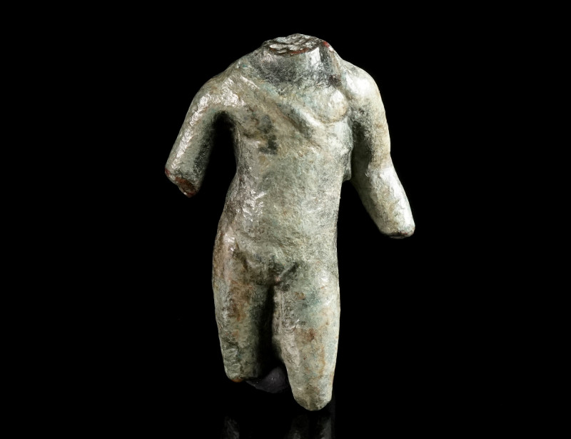A ROMAN BRONZE TORSO OF APOLLO Circa 1st-3rd century AD. Small bronze statuette,...