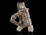 A ROMAN LEAD FIGURE OF A GLADIATOR Circa 2nd-3rd century AD. Thracian (Thraex) shown in combat, wearing a plumed helmet and holding a rectangular shie...