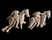 TWO ROMAN LEAD STATUETTES OF TRACIAN HORSEMEN Circa 2nd century AD. The heroes wearing tunic are depicted on their bridled horses. Both fragmented and...
