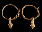 A PAIR OF ROMAN GOLD EARRINGS WITH PENDANT Circa 3rd century AD. The hoops of the earrings are made of twisted gold wire, each with hook-and-loop fast...