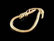 A ROMAN GOLD EARRING Circa 2nd-3rd century AD. Plain hoop with hook-and-loop fastener and a small decorative spiral on one end. Slightly bent. L 21 mm...