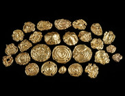 A SET OF 27 LATE BRONZE AGE GOLD DRESS ORNAMENTS Circa 12th-8th century BC. 24 round dress ornaments with concentric circles worked in repoussé, and t...