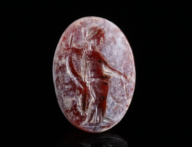 A ROMAN CARNELIAN INTAGLIO WITH FORTUNA Circa 1st-3rd century AD. Oval intaglio ...