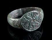 A MEDIEVAL BRONZE RING WITH A STAR Circa 13th-15th century AD. Ring with circular bezel with an engraved star. Ring size 56 (EU)

Ex European private ...