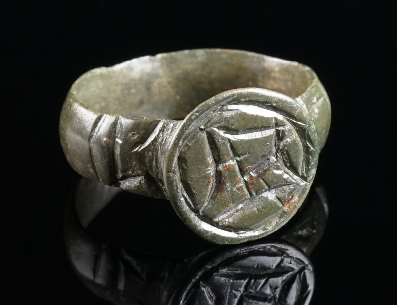 A LATE MEDIEVAL OR EARLY MODERN BRONZE RING Circa 15th-16th century AD. With a p...