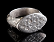 AN ELABORATELY DECORATED ISLAMIC MEDIEVAL SILVER RING Timurid dynasty, circa 15th century AD. A heavy silver ring with a navette-shaped bezel, all ove...