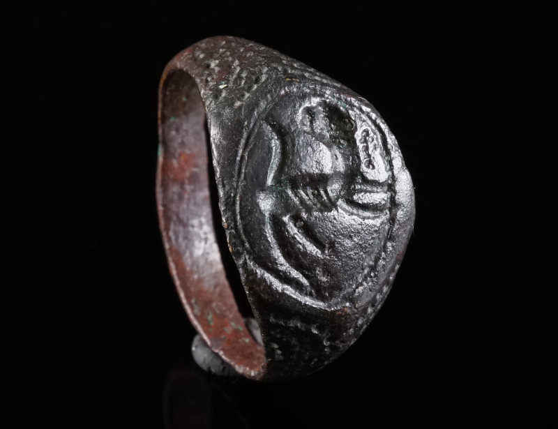 A BYZANTINE/MEDIEVAL BRONZE RING WITH A PANTHER Circa 12th-14th century AD. Ring...
