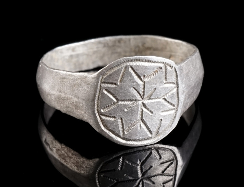 A MEDIEVAL SILVER RING WITH ORNAMENTAL DECORATION Circa 10th-13th century AD. Wi...