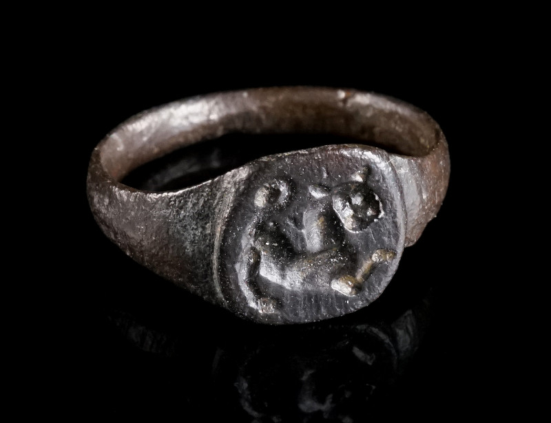 A LATE ANTIQUE/EARLY BYZANTINE BRONZE RING WITH A LION Circa 5th-7th century AD....