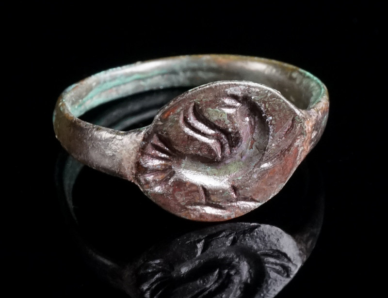 AN EARLY BYZANTINE BRONZE RING WITH A BIRD Circa 6th-7th century AD. With an ova...