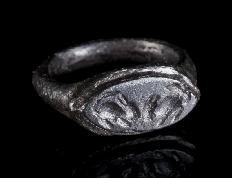 A SMALL ROMAN BRONZE RING WITH TWO MICE Circa 3rd century AD. With a navette-sha...