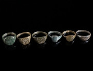 A GROUP OF SIX MEDIEVAL/EARLY MODERN BRONZE RINGS Circa 14th-16th century AD. All with decorated bezel. Ring size 54-60 (EU)

Ex private collection, a...