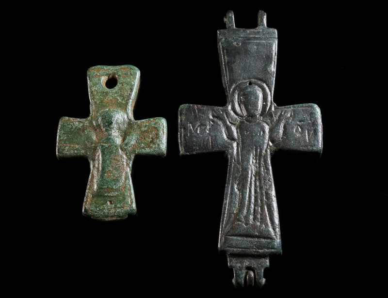 TWO BYZANTINE BRONZE RELIQUARY CROSSES Circa 10th-12th century AD. Two halves of...