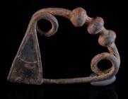 A GRAECO-THRACIAN IRON BOW BROOCH Circa 7th-6th century BC. The bow decorated with three knobs. With triangular catch plate; spring and pin. Rare in t...