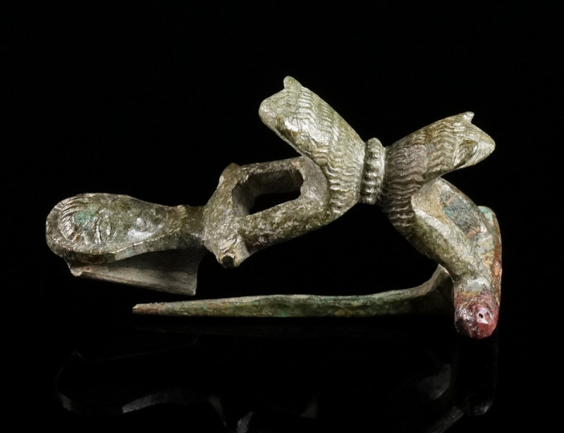 A ROMAN BRONZE LION BROOCH Circa 1st-2nd century AD. A fine bow brooch composed ...