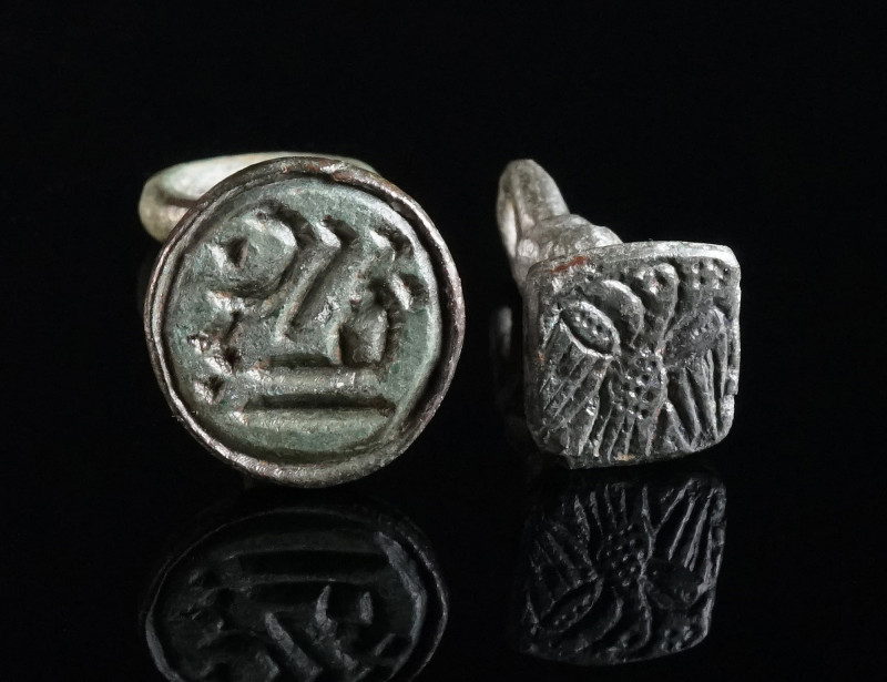 A BYZANTINE AND AN EARLY ISLAMIC BRONZE STAMP SEAL Circa 8th-10th century AD, an...