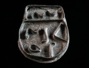 A BYZANTINE BRONZE BREAD STAMP Circa 5th-8th century AD. Made of cut pieces of bronze sheet, soldered together; with an abbreviated Greek inscription....