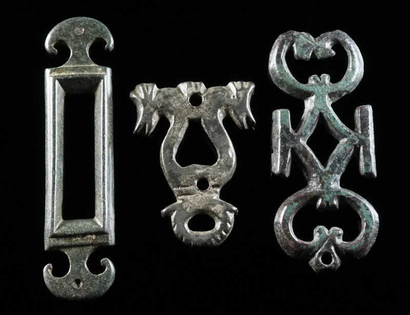 A GROUP OF THREE ROMAN BRONZE OPENWORK BELT FITTINGS Circa 2nd-3rd century AD. T...