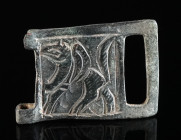 A BYZANTINE BRONZE BELT BUCKLE WITH A GRIFFIN Circa 9th-11th century AD. Square plate from a belt-buckle; in relief, a griffin striding left; two atta...