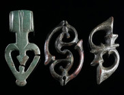 A GROUP OF THREE ROMAN BRONZE OPENWORK BELT FITTINGS Circa 2nd-3rd century AD. Two fittings worked in Romano-Celtic 'Trumpet-style', and a further ope...