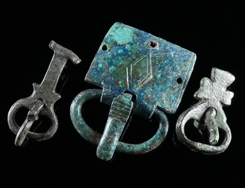 A GROUP OF THREE LATE ANTIQUE/BYZANTINE BRONZE BELT BUCKLES Circa 5th-7th centur...