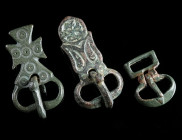 A ROMAN BRONZE BUCKLE AND TWO BYZANTINE BELT BUCKLES Circa 3rd-4th century AD, and 6th-7th century AD. A small Roman bronze buckle; and two Byzantine ...