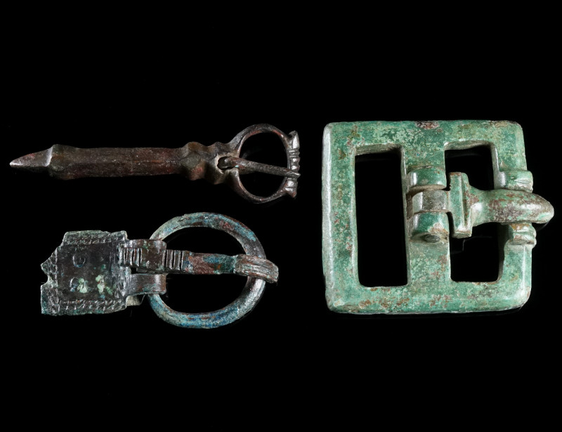 A GROUP OF THREE LATE ANTIQUE/BYZANTINE BRONZE BELT BUCKLES Circa 5th-7th centur...