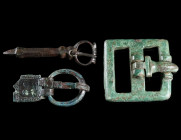 A GROUP OF THREE LATE ANTIQUE/BYZANTINE BRONZE BELT BUCKLES Circa 5th-7th century AD. Three buckles of different size and design. Plate of one buckle ...