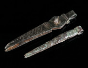 TWO PAIRS OF BYZANTINE BRONZE TWEEZERS Circa 5th-7th century AD. Cosmetic tweezers decorated with a series of incised lines and ring-and-dot motifs. L...
