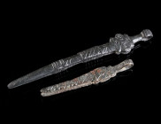 TWO PAIRS OF BYZANTINE BRONZE TWEEZERS Circa 5th-7th century AD. Cosmetic tweezers. The large piece elaborately decorated with a cross (pattée) with r...