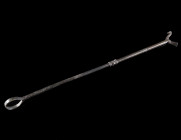 A DECORATED BYZANTINE BRONZE DISTAFF Circa 6th-7th century AD. Distaff (spinning tool) with a plain ring with grooves at the base and a stylised bird ...