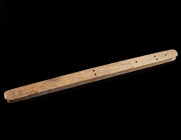 A ROMAN BONE INSTRUMENT/TOOL Circa 1st-4th century AD. An instrument of uncertain function with drilled marks on the top; possibly a weaving tool. L 1...