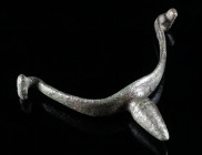A GERMANIC BRONZE SPUR Circa 2nd-3rd century AD. Prick spur with central goad and side arms with T-shaped lugs. L 42 mm, W 60 mm

Ex Austrian private ...