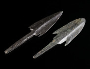 TWO IRON AGE BRONZE ARROWHEADS Circa 1st half of 1st millennium BC. Two barbed arrowheads with tang for fitting onto a wooden shaft. L 88-96 mm

Ex Eu...