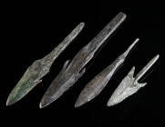 A GROUP OF FOUR ANCIENT BRONZE ARROWHEADS Circa 1st millennium BC. The two long barbed arrowheads with tang probably Iron Age, the two smaller probabl...