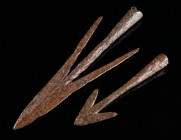 TWO MEDIEVAL IRON SWALLOWTAIL ARROWHEADS Circa 10th-14th century AD. Both socketed; the larger arrowhead with twisted neck. L 77 mm, and L 123 mm

Ex ...