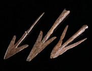 A GROUP OF THREE MEDIEVAL IRON SWALLOWTAIL ARROWHEADS Circa 10th-14th century AD. Two socketed arrowheads, one with tang. L 75-103 mm

Ex European pri...