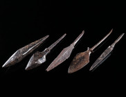 A GROUP OF FOUR MEDIEVAL IRON ARROWHEADS AND A TOOL Circa 10th-14th century AD. Four arrowheads with different body/head shapes; and a tool (possibly ...