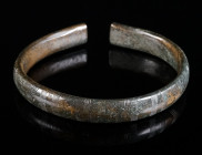 A DECORATED EUROPEAN LATE BRONZE AGE BRACELET Circa 10th-8th century BC. Bronze bracelet with an elaborate, incised geometric decoration and a beautif...