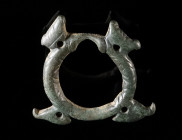 A DECORATED CELTIC BRONZE RING AMULET WITH BIRDS Circa 2nd-1st century BC. Celtic ring pendant with four birds and incised geometric decoration. Attra...