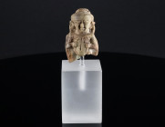 AN EGYPTIAN FAIENCE FIGURE OF PATAIKOS Late Period, 26th-30th Dynasty, 664-342 BC. A well modelled representation of the dwarf god Pataikos. Head topp...